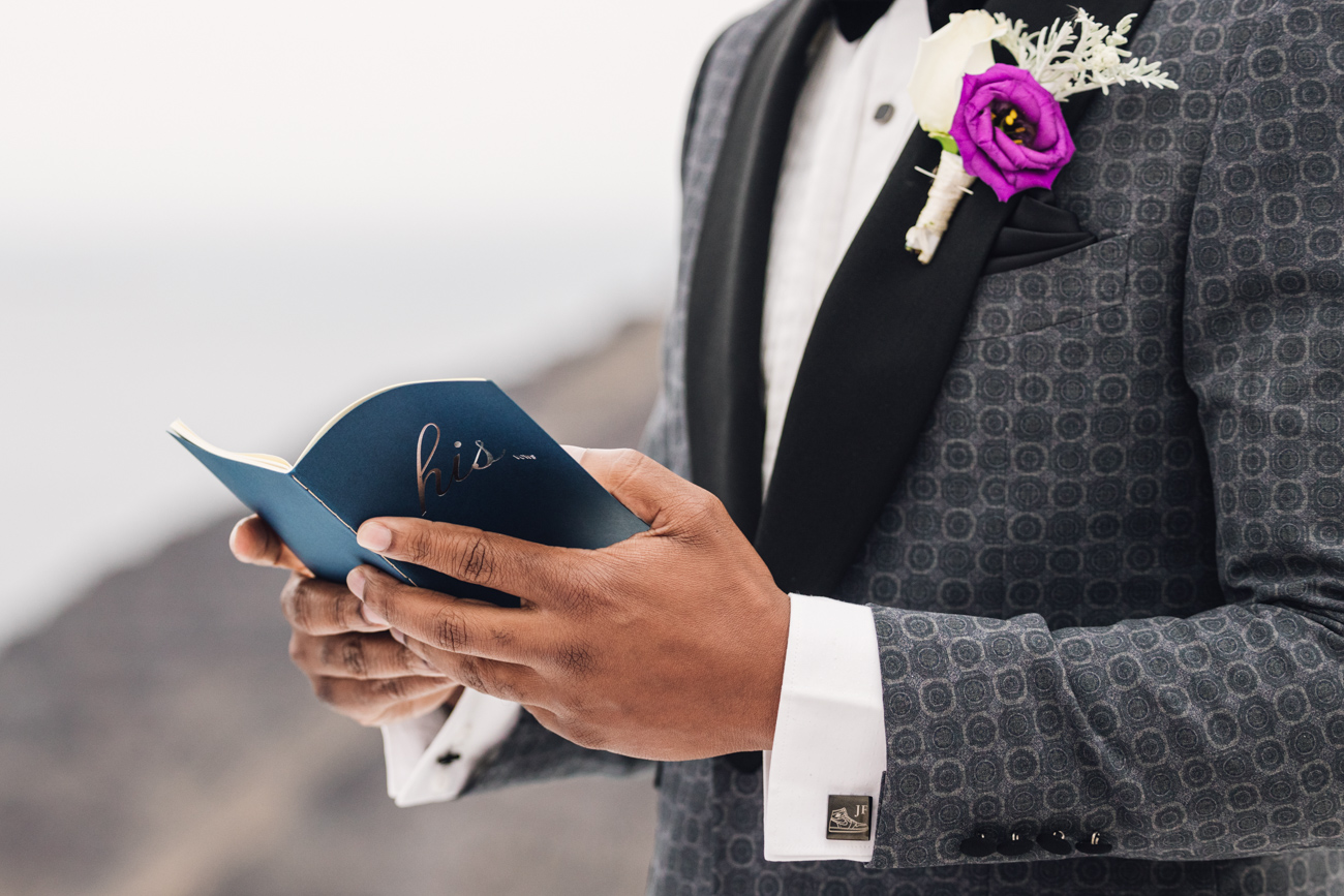 Groom holding her wedding vows