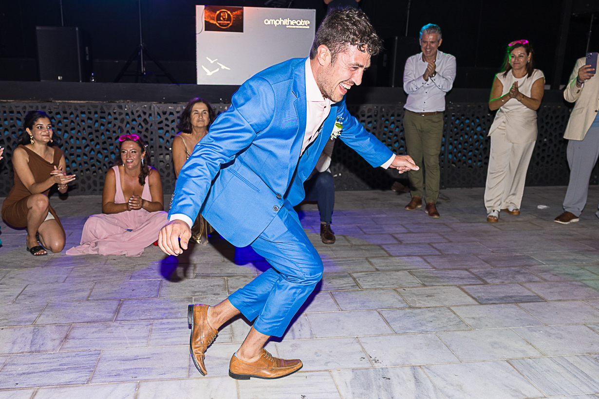 Groom's brother dancing a zeibekiko during his wedding reception at the Lindos Amphitheatre in Rhodes.