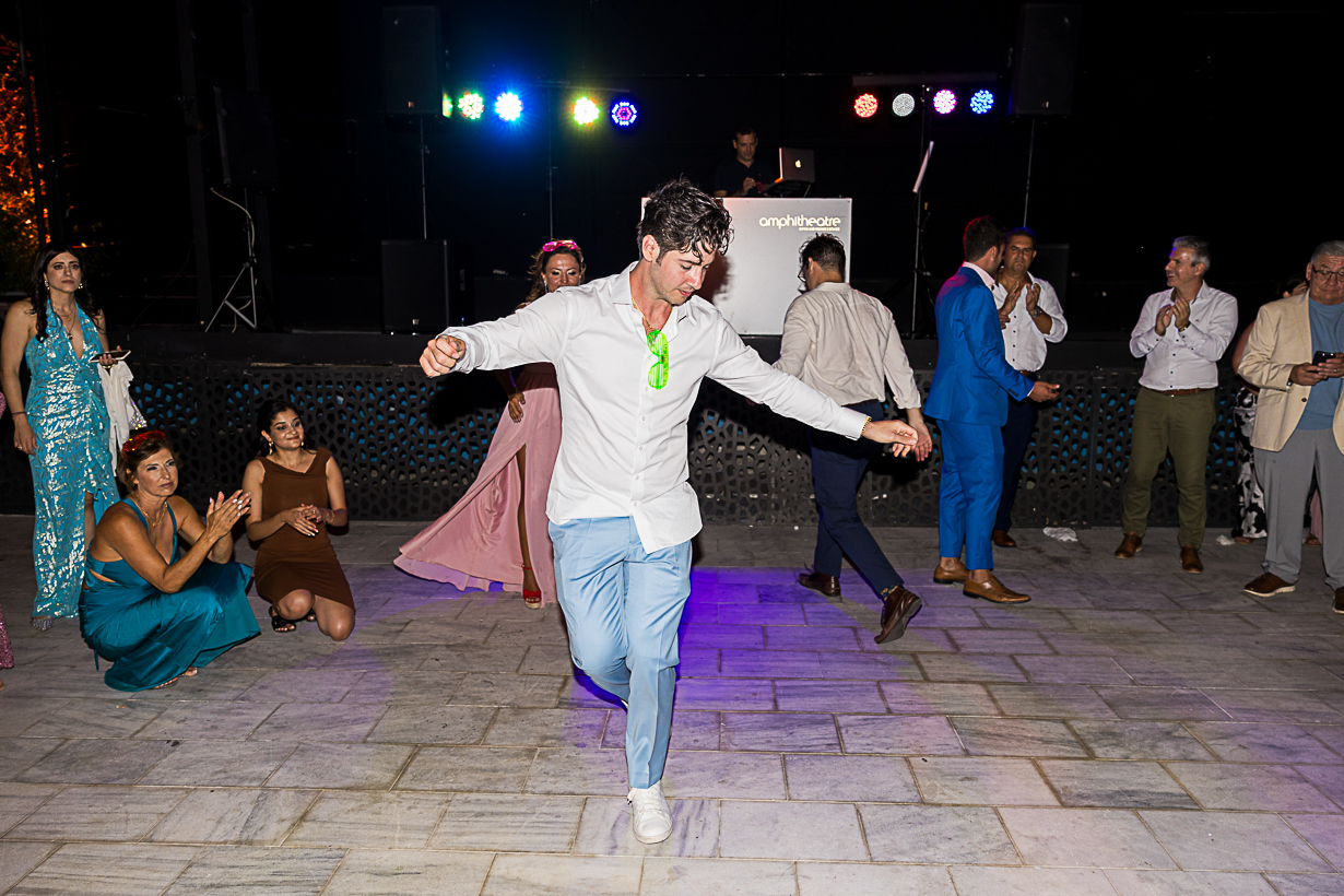 Groom dancing a zeibekiko during his wedding celebration in Lindos.