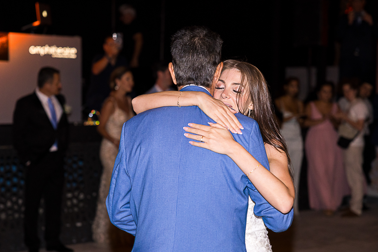 Bride and groom sharing their first dance at the wedding reception in Lindos.